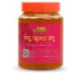 A 500g jar of Bonobithi Lychee Flower Honey with red label and orange lid, labeled 100% pure and additive-free